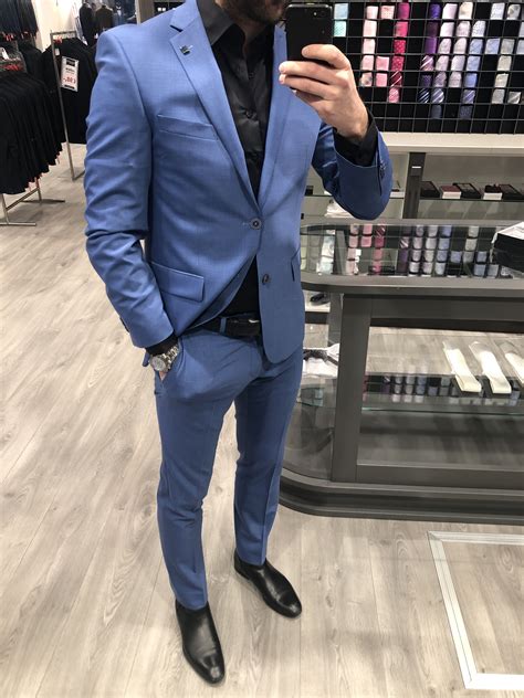 light blue suit black shirt